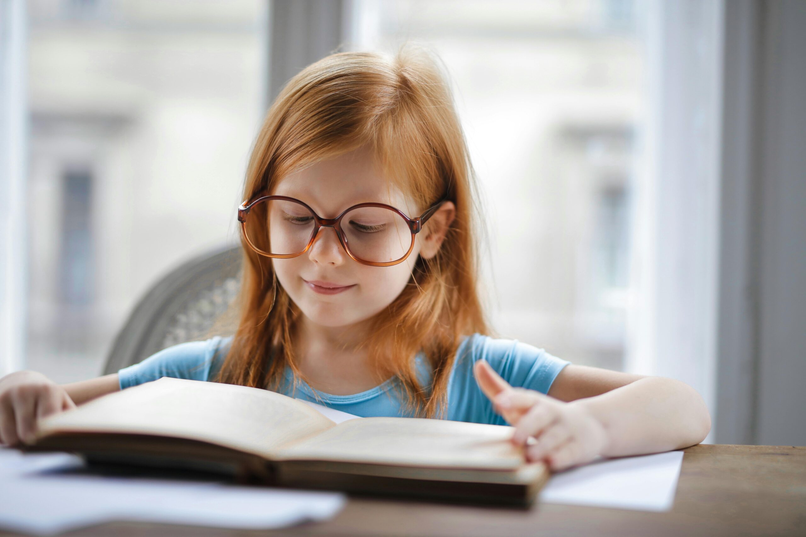 Young girl reading a book